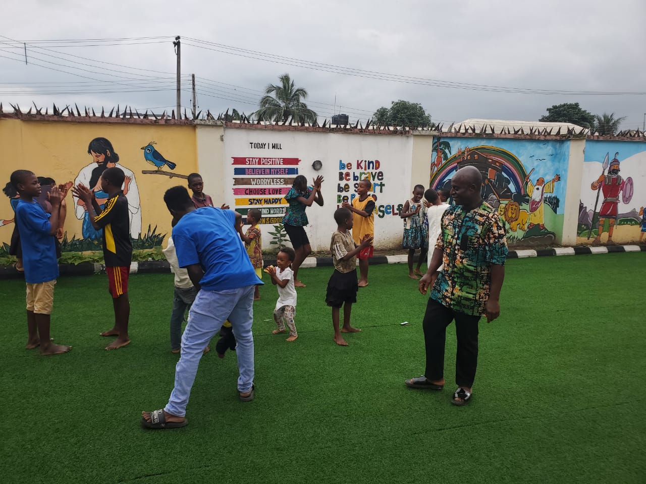 Volunteers and children at Hope City